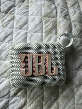 JBL Portable Bluetooth Speaker in Light Gray with Coral Logo